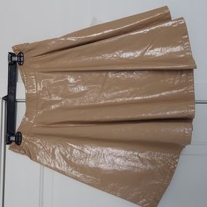 Flayed beige leather mini skirt